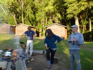 The cabins are rustic, but the barbecued pizza Blake is cooking on the fire ring is to die for.